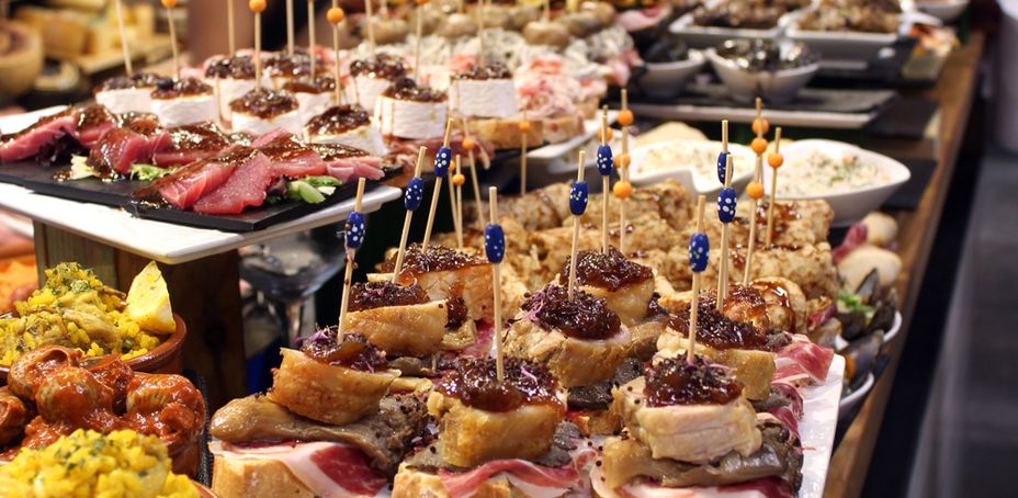 Variety of tapas dishes on toothpicks arranged for display in a Barcelona restaurant.