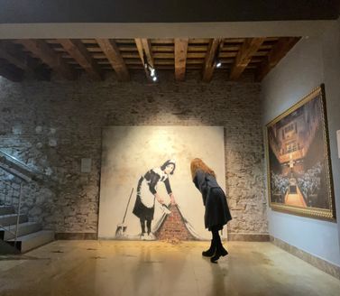 Visitors viewing Banksy art in Barcelona