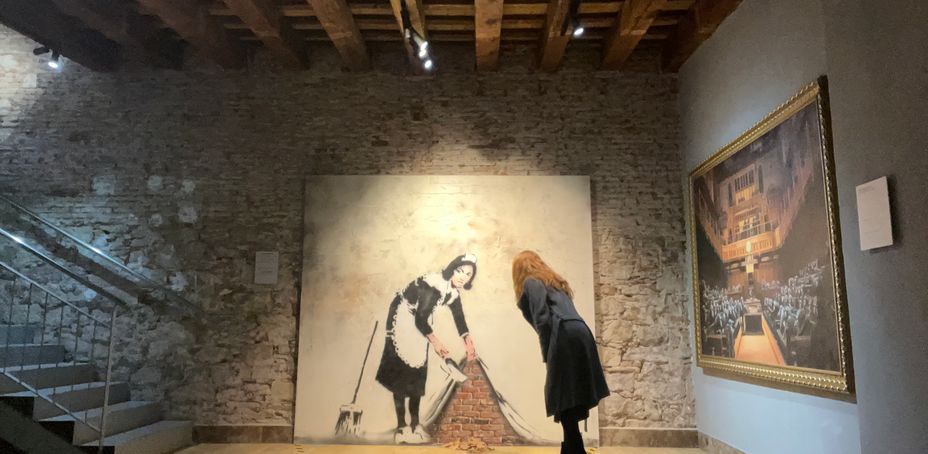 Visitors viewing Banksy art in Barcelona