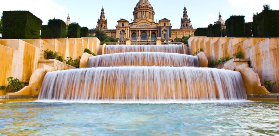 Large fountains with cascading water in front of the National Art Museum of Catalonia in Barcelona, Spain.