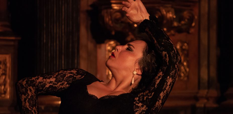 Flamenco dancer in a black lace dress performing passionately in Barcelona