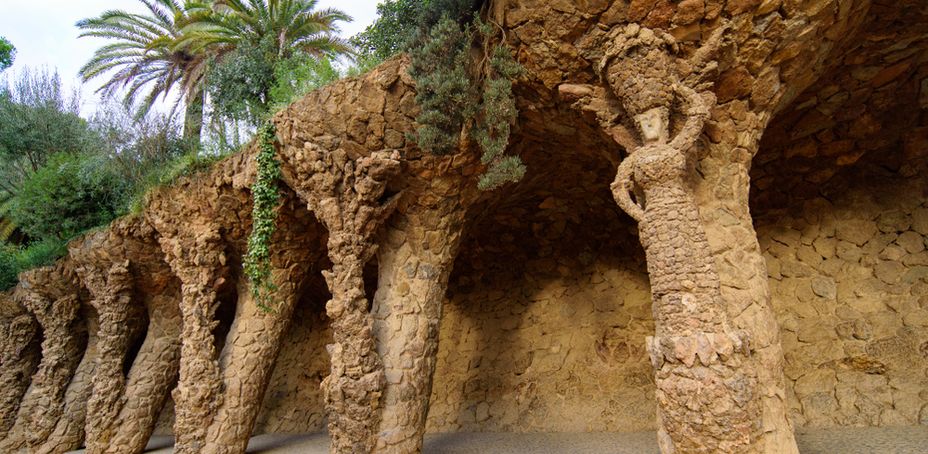 Rock formations with sculpted figures at Park Guell in Barcelona.