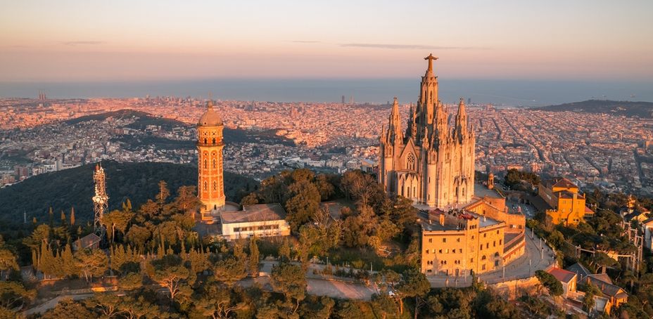 Aerial view of Tibidabo mountain and Sagrat Cor church overlooking Barcelona